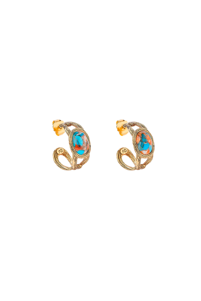 Aurelie Bidermann's Alicanta earrings - inspired by Chile's Atacama desert, gilded with 750/1000 gold, adorned with a turquoise oyster stone, and set on a gold mesh.