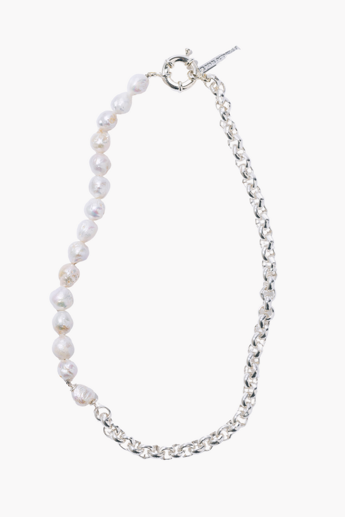 Make a bold fashion statement with the Paris Diamond Necklace from Pearl Octopuss.y, featuring white freshwater pearls and silver plated rondelle crystals.