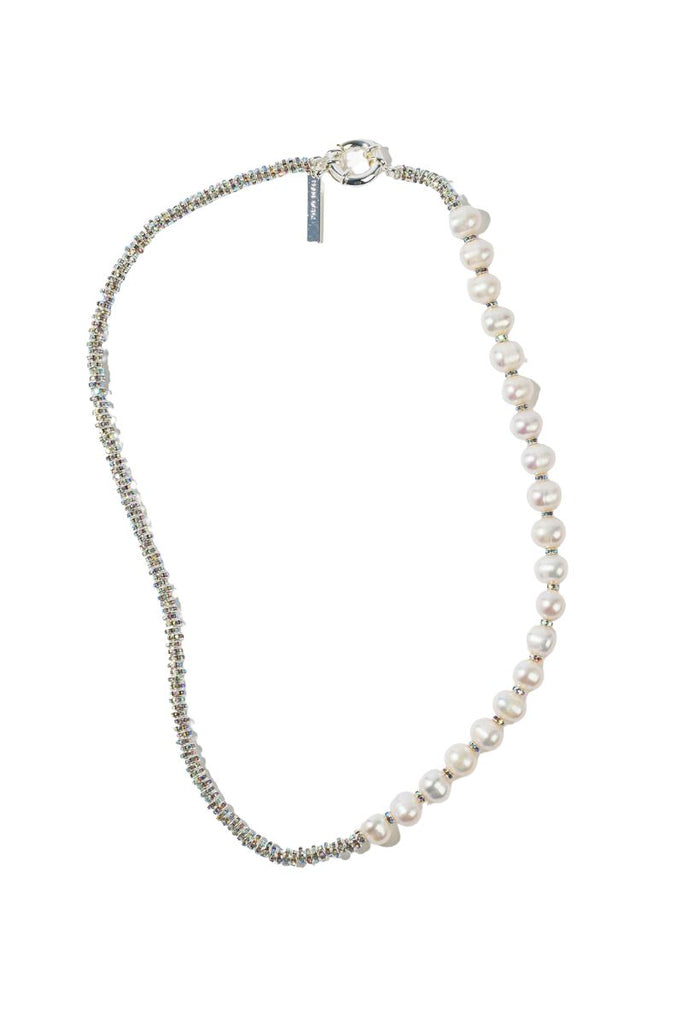 Make a bold fashion statement with the Paris Diamond Necklace from Pearl Octopuss.y, featuring white freshwater pearls and silver plated rondelle crystals.