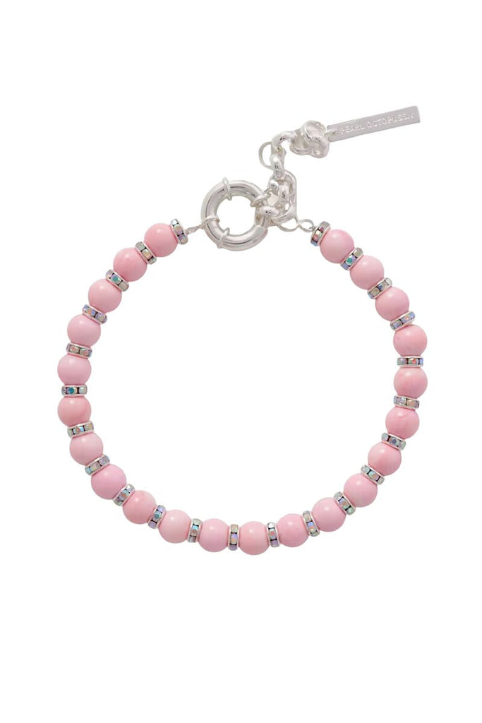 Make a statement with the elegant Pearl Octopuss.y Pink Lily Bracelet featuring delicate pink shell beads and iridescent crystals that can be dressed up or down.