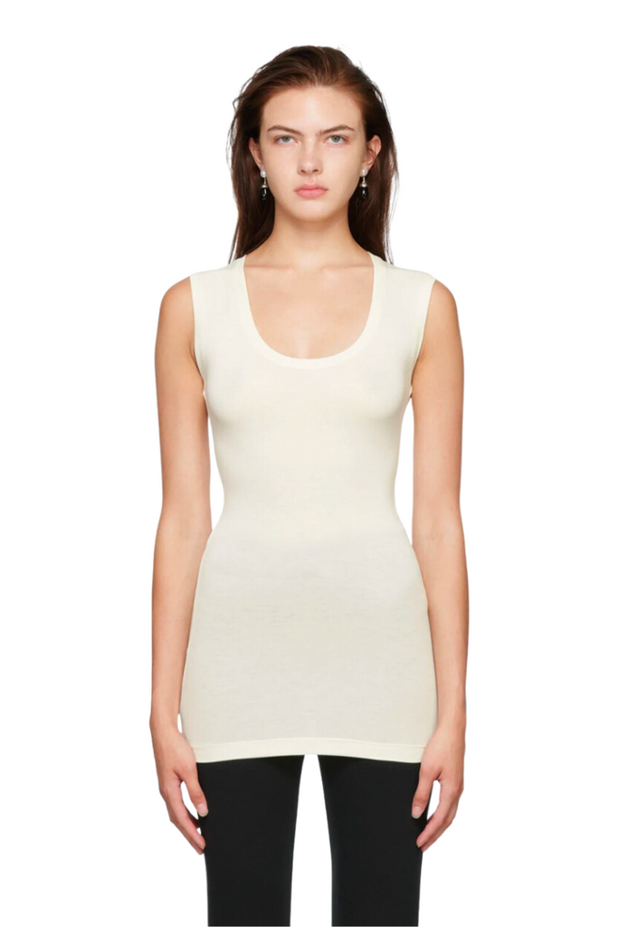 The Second Skin Top by Bite Studios is a versatile, sustainable, and chic sleeveless tank top made from semi-transparent organic cotton that adds a touch of sophistication to any outfit.