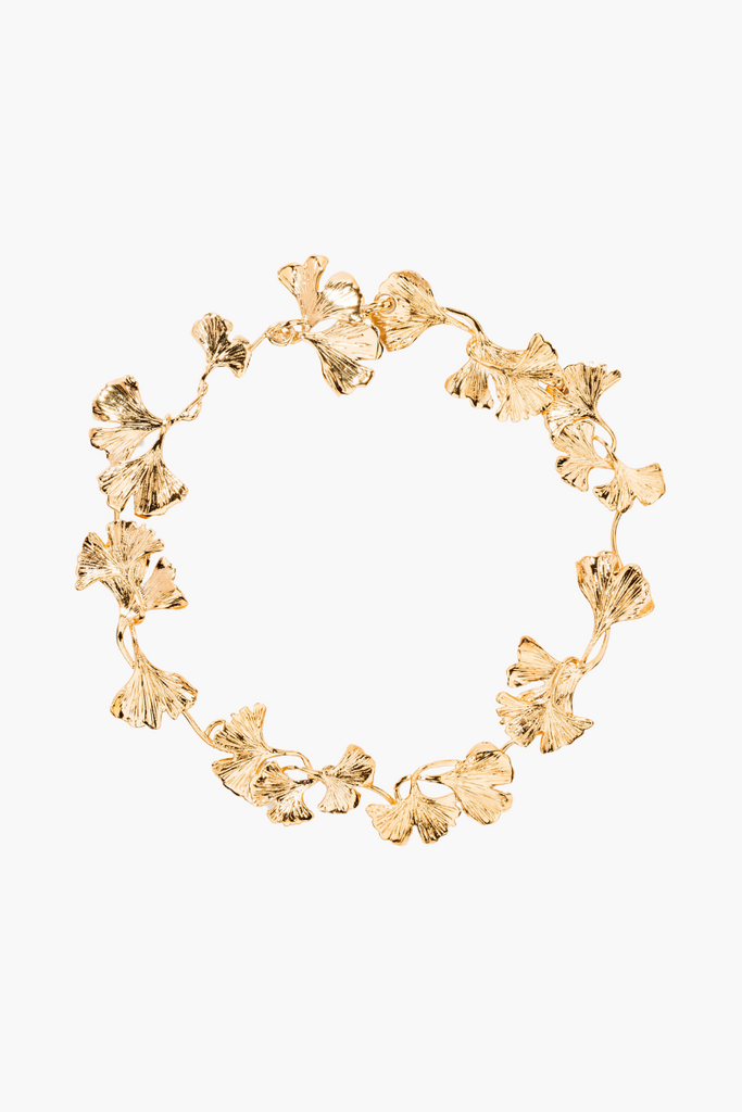 Elevate your style with the luxurious and captivating Tangerine Necklace from Aurélie Bidermann's Tangerine collection, crafted from 750/1000 yellow gold with an intricately designed Ginkgo leaf symbolizing prosperity, charm, and tranquility.