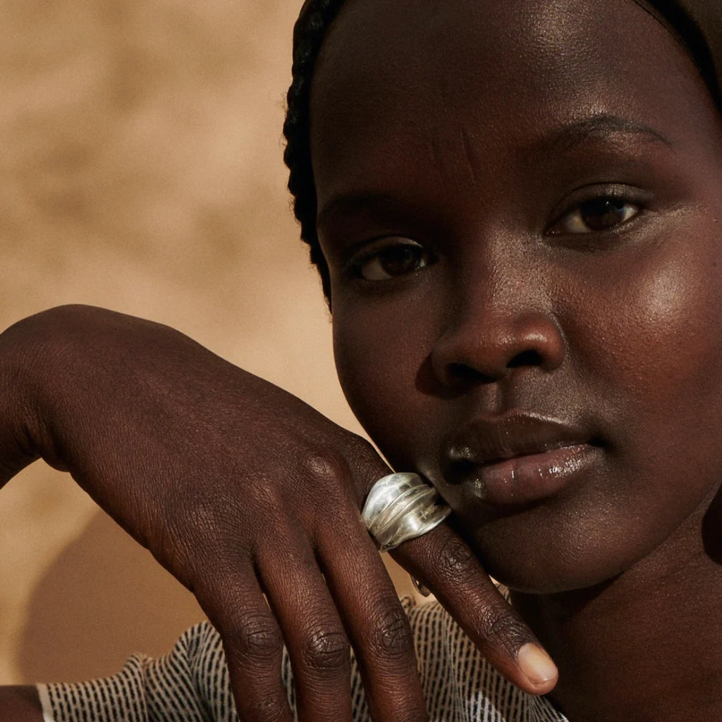 Close-up of a person with a ring on their finge Ranunculus Ring Ariana Boussard-Reifel