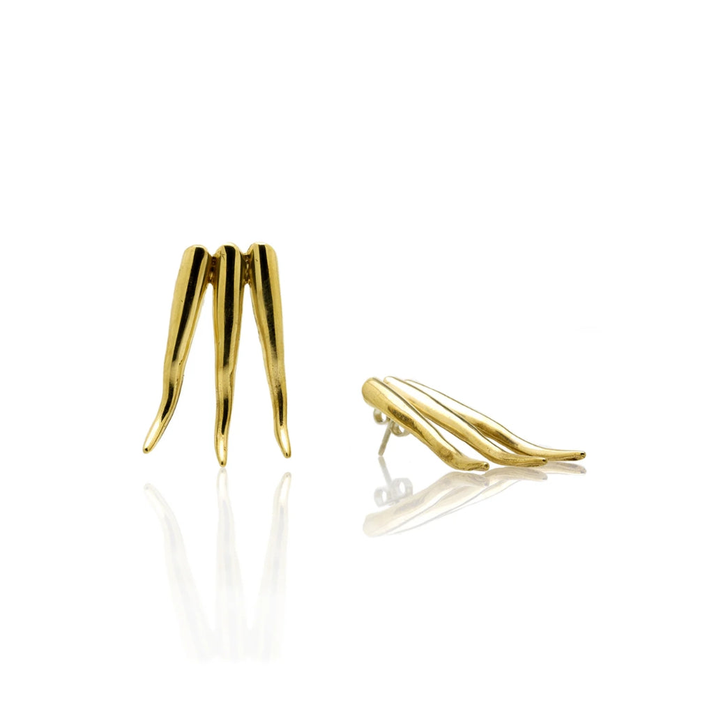 Gold earrings on a white background