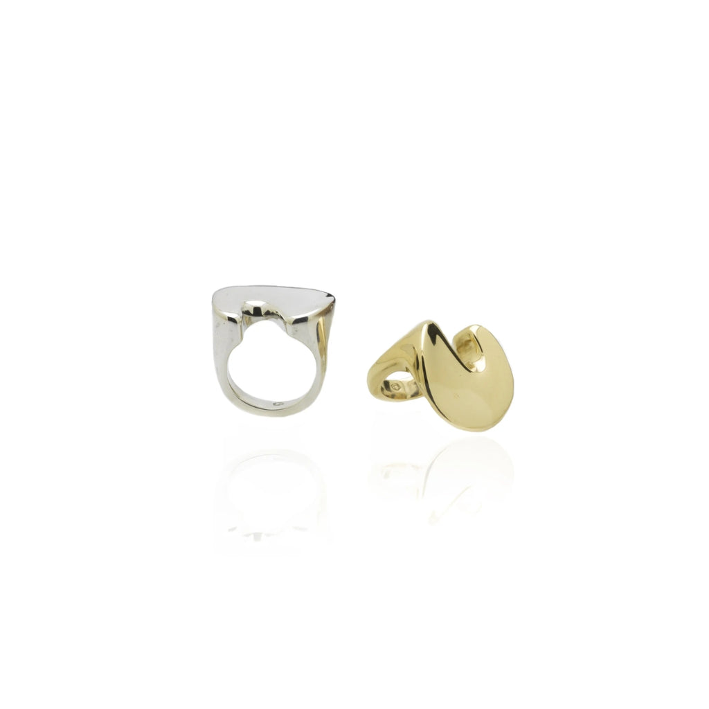Silver and gold rings on a white background