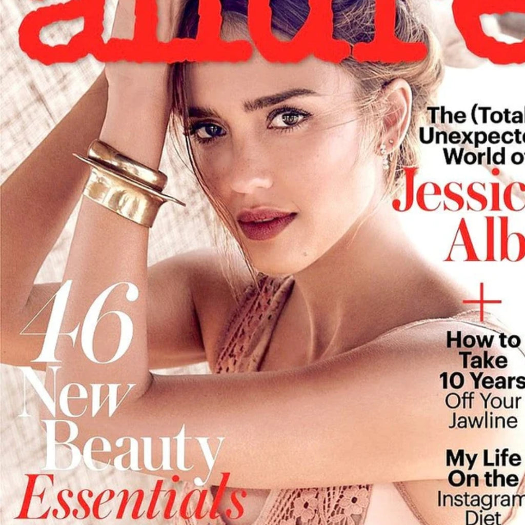 Magazine cover featuring a woman with text about beauty products and lifestyle.