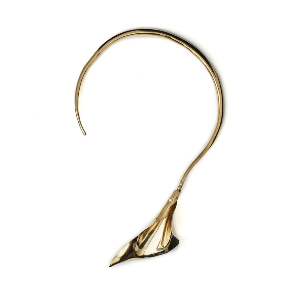 A sculptural gold collar necklace inspired by calla lilies.