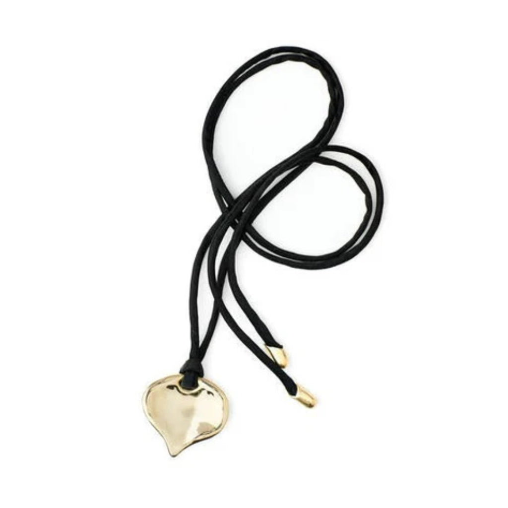 Black hair tie with a gold heart-shaped pendant on a white background