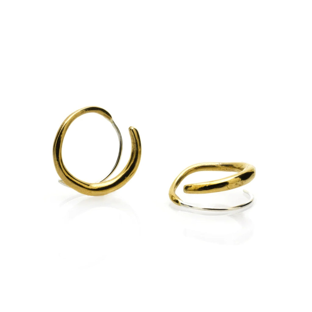 Two gold hoop earrings on a white background