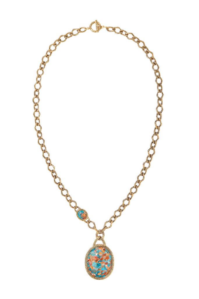 Aurelie Bidermann's Alicanta necklace - inspired by Chile's Atacama desert, gilded with 750/1000 gold, adorned with a turquoise oyster stone, and set on a gold mesh.