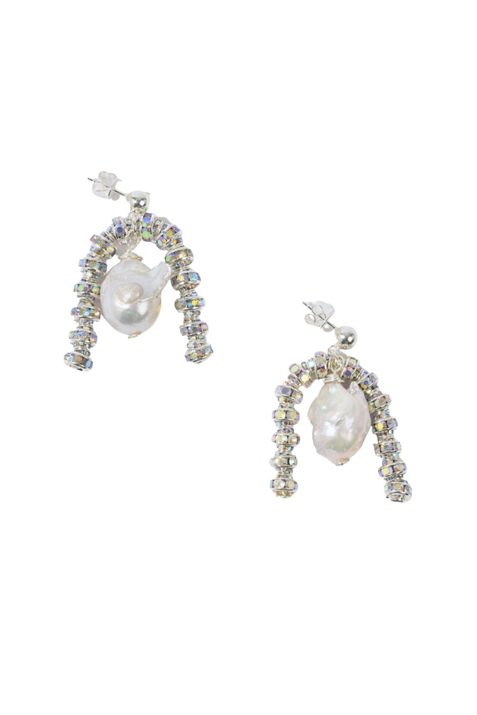 Make a statement with the unique and elegant Baroque Paris Earrings from Pearl Octopuss.y, featuring oversized Baroque Freshwater Pearls, silver plated rondelle beads, and silver sterling ear studs.