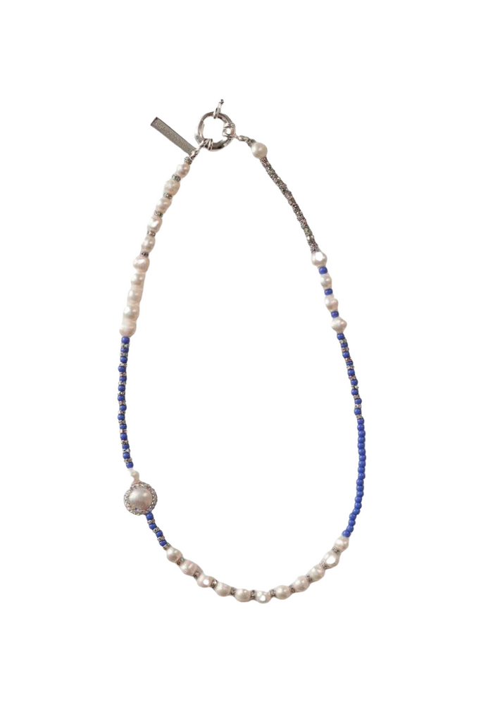 Elevate your style with the sophisticated and mystique Blue Pearl Necklace by Pearl Octopuss.y, featuring a unique blend of white and black irregularly shaped freshwater pearls.
