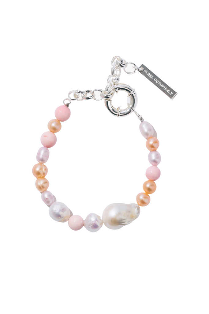 Make a statement with the unique Bon Bon Bracelet from Pearl Octopuss.y , featuring a mix of hand-dyed freshwater pearls and an oversized baroque pearl detail.
