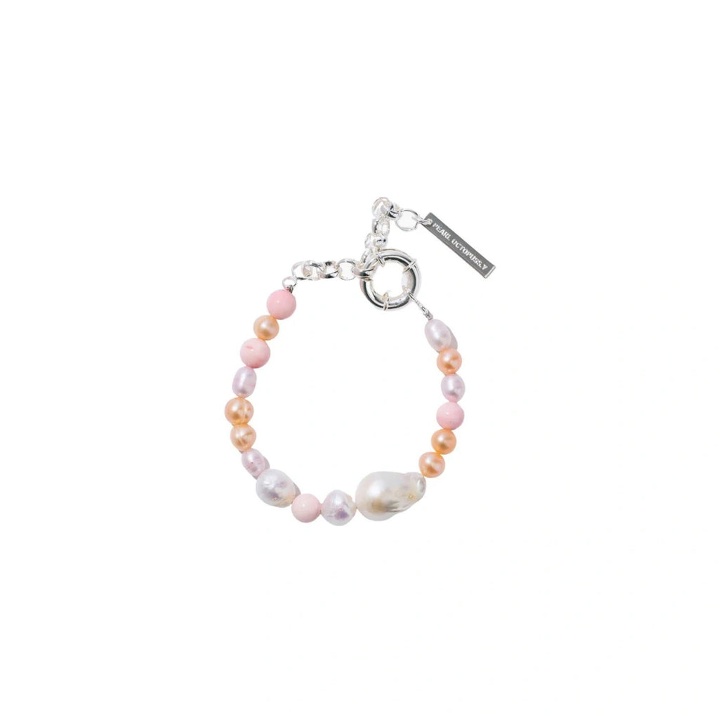Make a statement with the unique Bon Bon Bracelet from Pearl Octopuss.y , featuring a mix of hand-dyed freshwater pearls and an oversized baroque pearl detail.