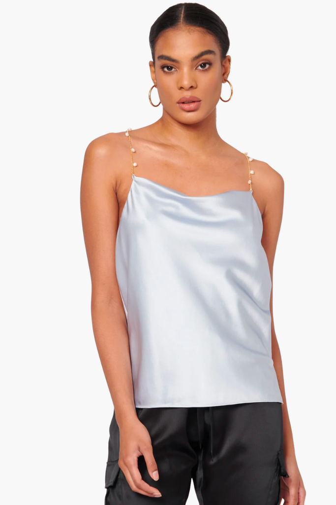 Upgrade your wardrobe with the timeless elegance of the Busy Cami in Halogen Blue from CAMI NYC, featuring a cowl neckline, pearl chain straps, and silk stretch sandwash charmeuse that's perfect for dressing up or down.