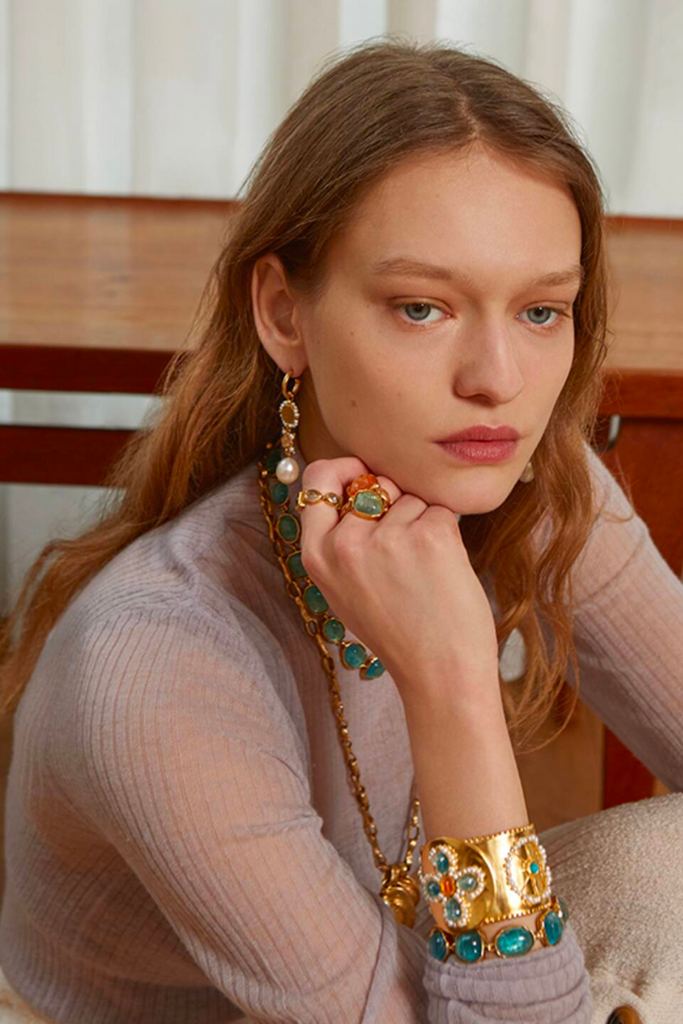The Cabochons Bracelet from Goossens Paris is a luxurious and playful piece of jewelry inspired by the changing colors of the seasons, featuring carefully selected and cut stones in aqua blue tint that exude a sense of peace and serenity.