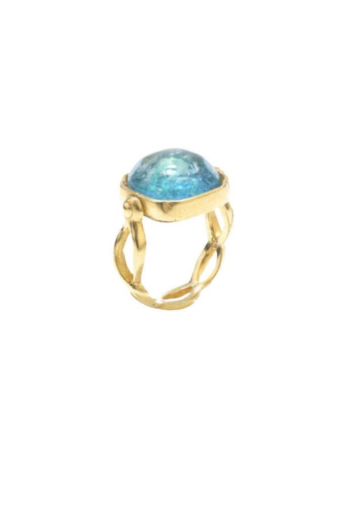 The Cabochons Squared Ring by Goossens Paris is a timeless piece of jewelry with hand-dyed rock crystal stones, tempered brass ring soaked in 24-carat gold bath, and a square cabochon centerpiece made of rock crystal tinted with aqua blue, showcasing the brand's fine craftsmanship and attention to detail.