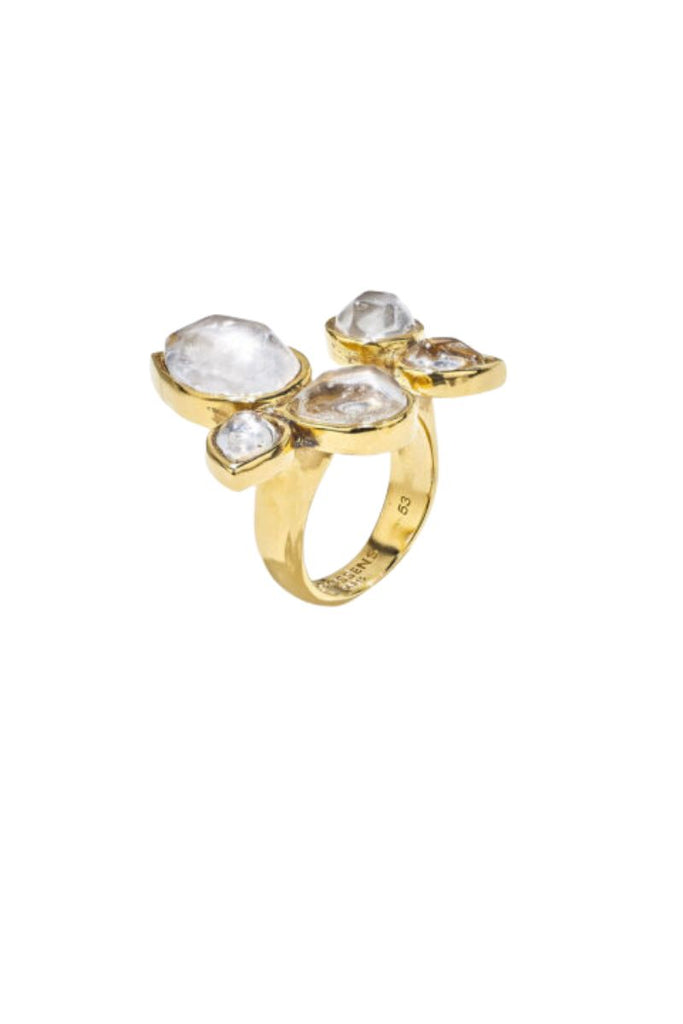 The Cachemire collection features delicate and intricate designs inspired by traditional Indian jewelry, with a focus on rock crystal and yellow gold, and the Cachemire 5 Cabochons Ring is a unique embodiment of this style, crafted from 24-carat gold-soaked brass and featuring five cabochon-cut crystals.