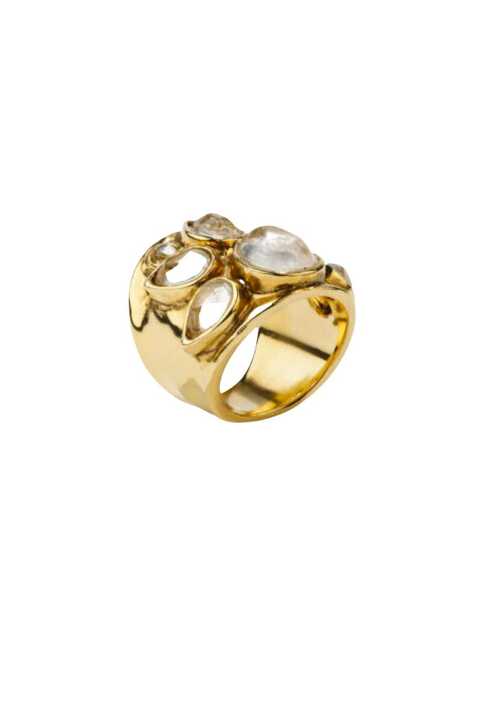 The Cachemire collection, inspired by traditional Indian jewelry, features intricate designs with rock crystal and yellow gold, and the Cachemire 6 Cabochons Ring is a unique example made from 24-carat gold-soaked brass with six cabochon-cut crystals.
