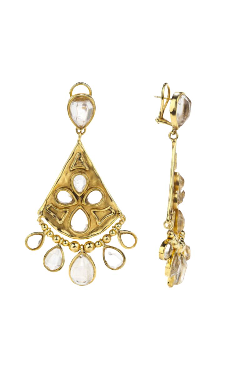 The Cachemire collection features delicate and intricate jewelry inspired by traditional Indian designs, with the centerpiece being a rock crystal cut into a drop shape and surrounded by yellow gold, as seen in the Cachemire Pendant Earrings.