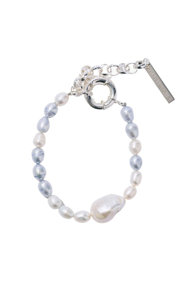 Make a statement with the unique Clouds Pearl Bracelet from Pearl Octopuss.y , featuring a mix of hand-dyed freshwater pearls and an oversized baroque pearl detail.