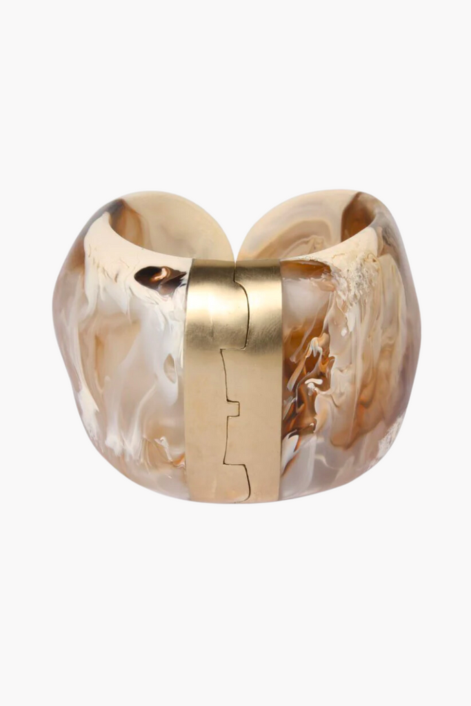 Elevate any outfit with the stunning Resin Bold Stone Cuff in Light Horn by Dinosaur Designs, featuring a unique swirl pattern and brass hinge.