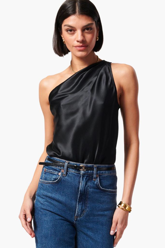  The Darby Bodysuit is a chic and comfortable one-shoulder style made from silk stretch sandwash charmeuse with an asymmetrical draped neckline and pleats at the shoulder and wearer's right side seam, making it a must-have wardrobe essential.