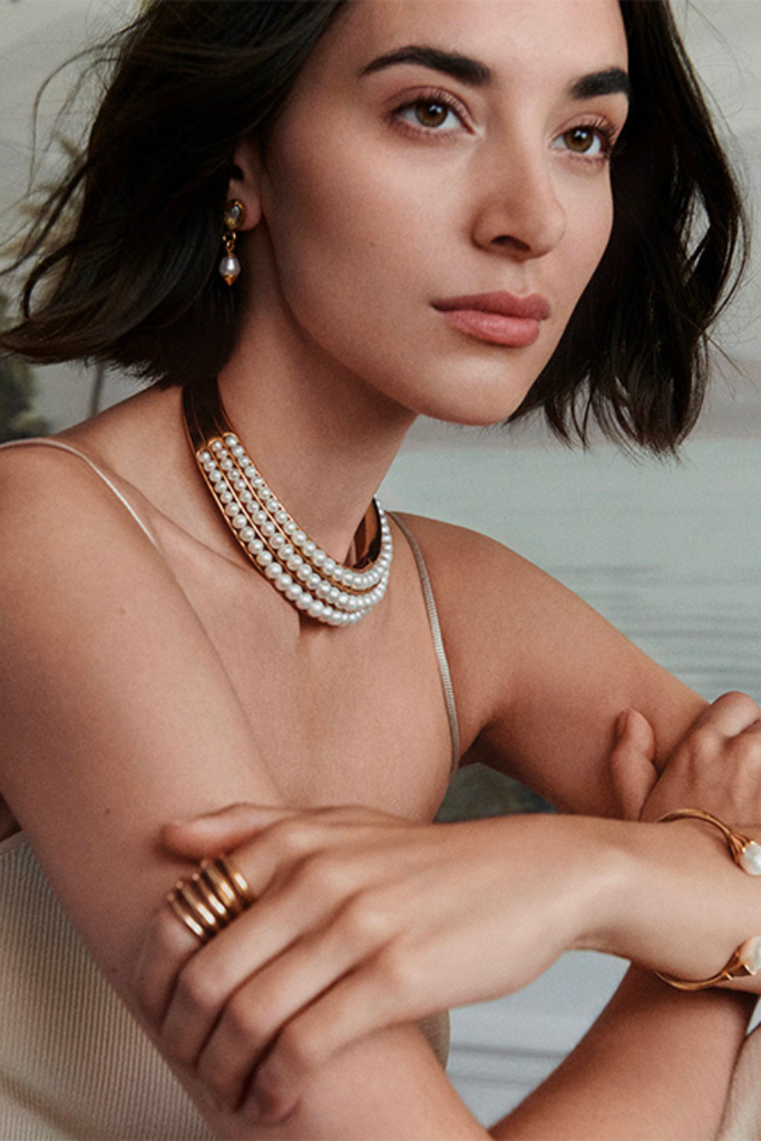 The Graine de Gemmes collection is a delicate and luxurious jewelry line featuring dainty designs and beautiful baroque pearls, with the torque being a perfect example of its subtle elegance.