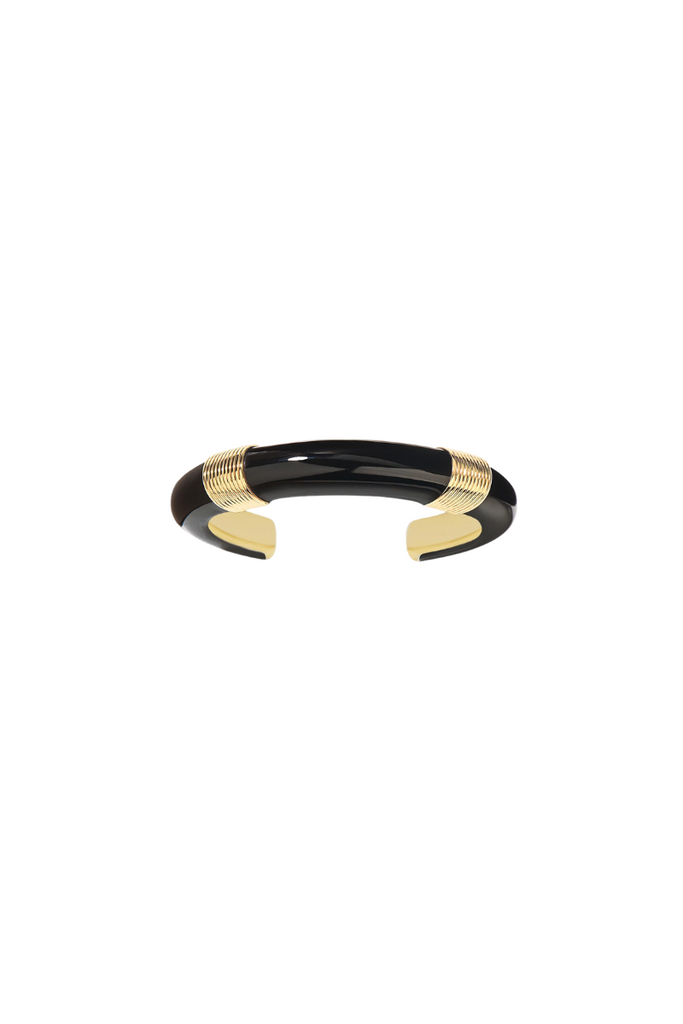 Katt bracelet by Aurelie Bidermann. Inspired by Bauhaus design, this bracelet features pure lines and a minimalist aesthetic, paying tribute to Katt Both. The high-end black color adds a touch of elegance to the sophisticated design, perfect for dressing up or down.