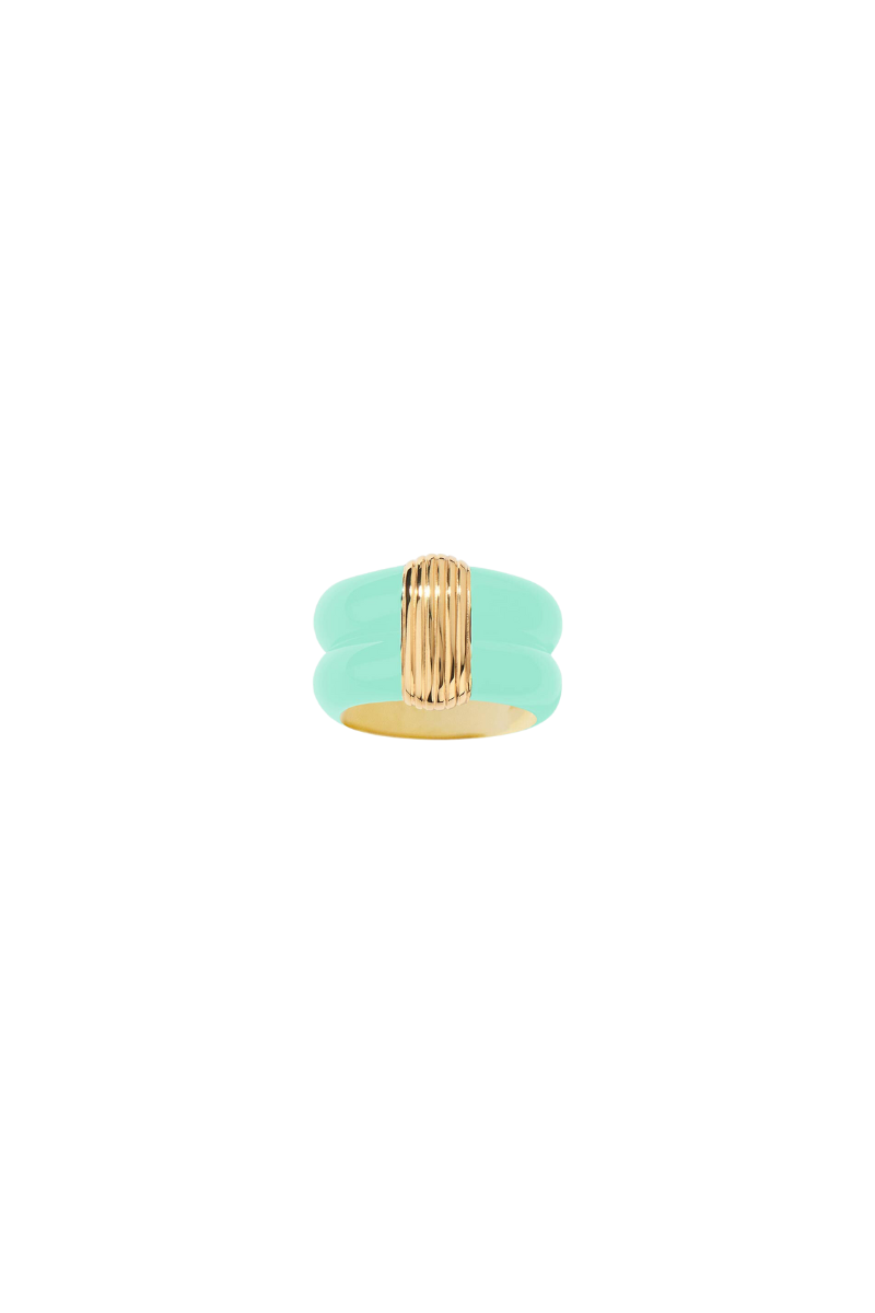 Katt ring by Aurelie Bidermann. Inspired by Bauhaus design, this ring features pure lines and a minimalist aesthetic, paying tribute to Katt Both. The playful baby blue color adds a touch of fun to the sophisticated design, perfect for dressing up or down.