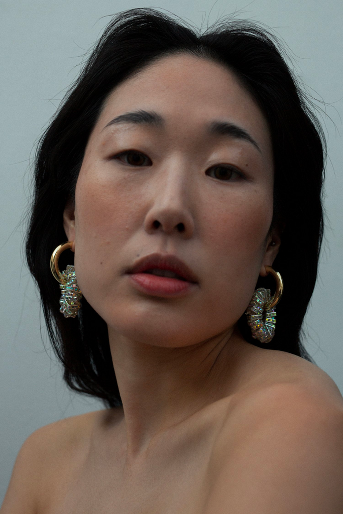 Make a bold statement with Pearl Octopuss.y's Les Créoles Grandes, featuring chunky ear hoops with silver plated beads adorned with sparkling crystals, 14K gold plating, and a 925 silver sterling hoop hook.