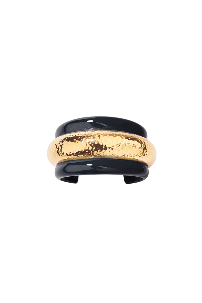 Modern and edgy, the Aurelie Bidermann Nazca cuff features a sleek black resin band with hammered brass detailing and striking gold accents.