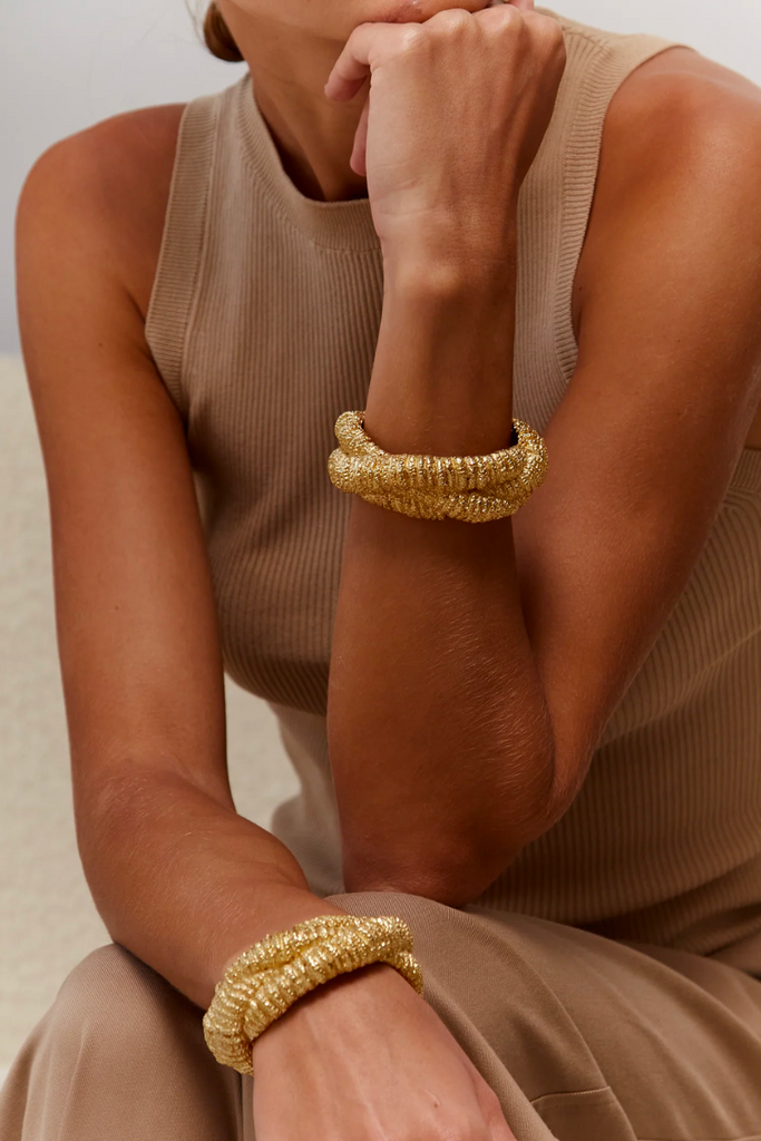The Paola Sighinolfi Nomad Bracelet is a bold and daring piece of jewelry featuring an intricate knot detailing on a multi-layered design with a unique and edgy texture, perfect to showcase your unique style and add sophistication to any outfit.
