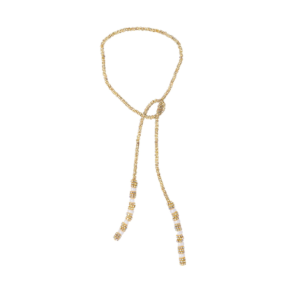 Gold beaded necklace on a white background