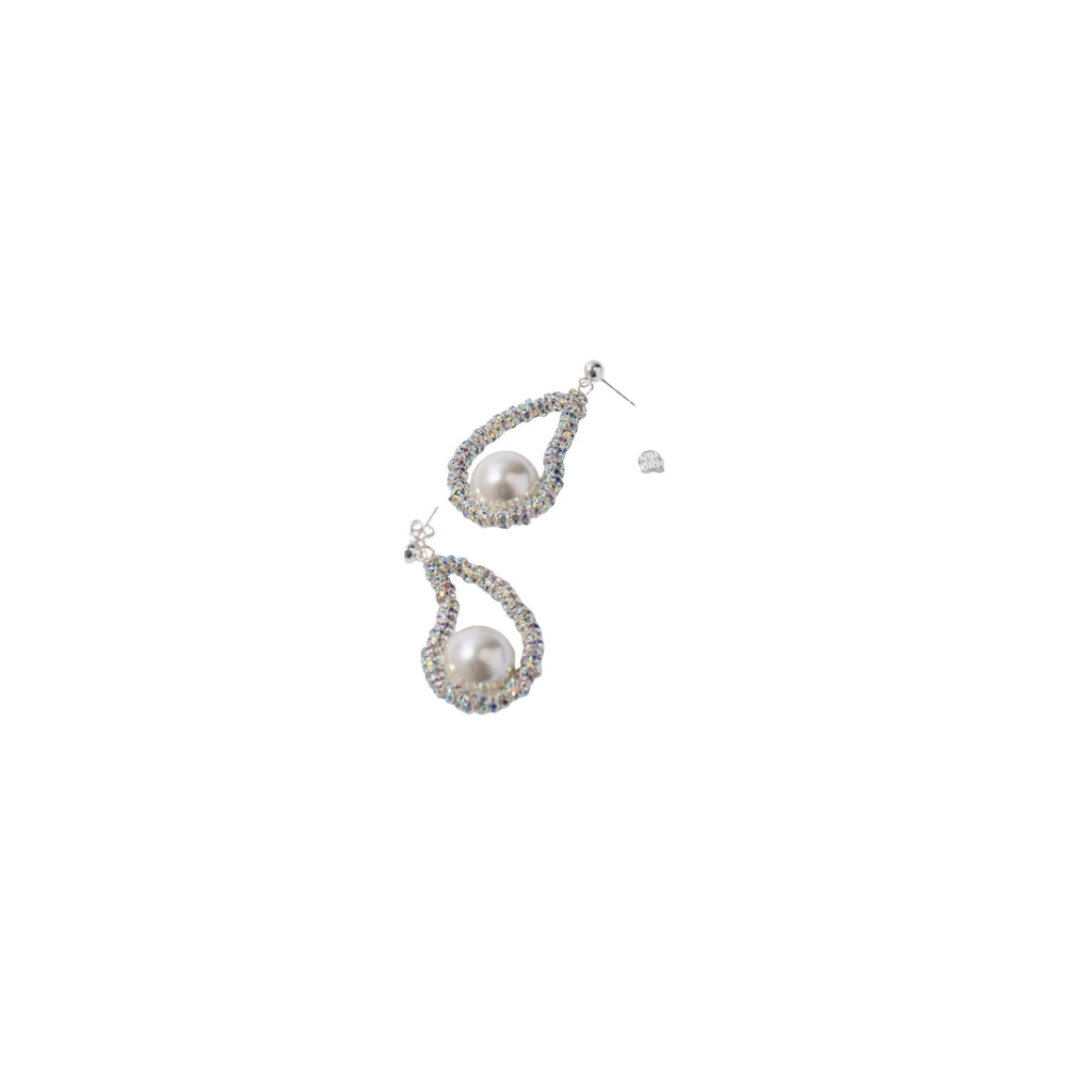 Pair of pearl teardrop earrings on a white background