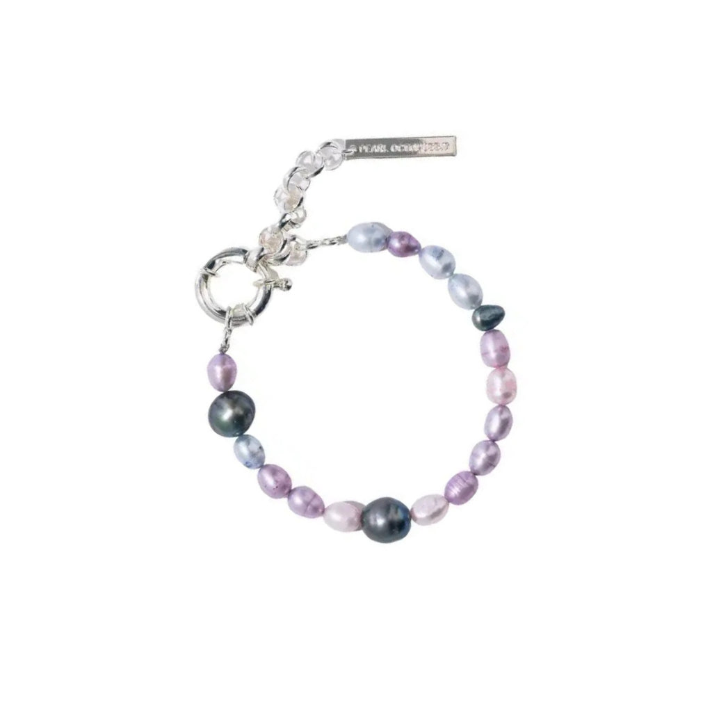 Pearl bracelet with silver clasp on a white background