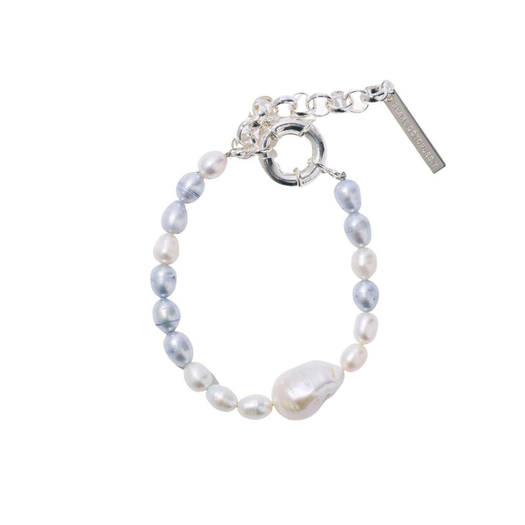 Pearl bracelet with silver clasp on a white background