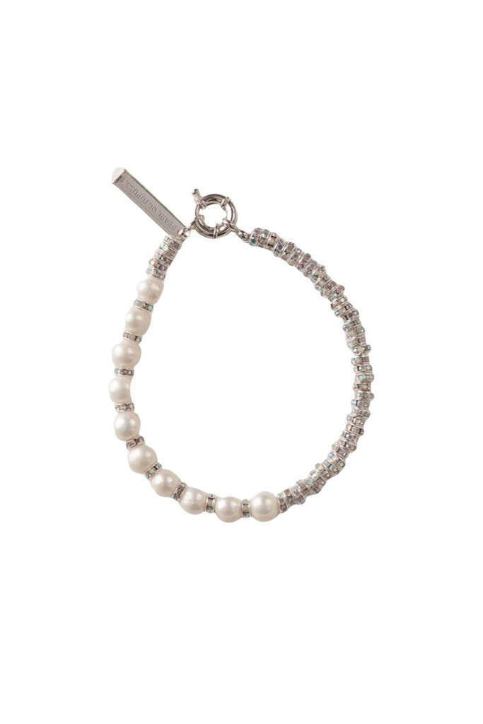 Elevate your style and make a statement with the Paris Diamond Bracelet by Pearl Octopuss.y, a luxurious and elegant piece of jewelry featuring freshwater pearls, AB crystals, and an engraved logo plate.