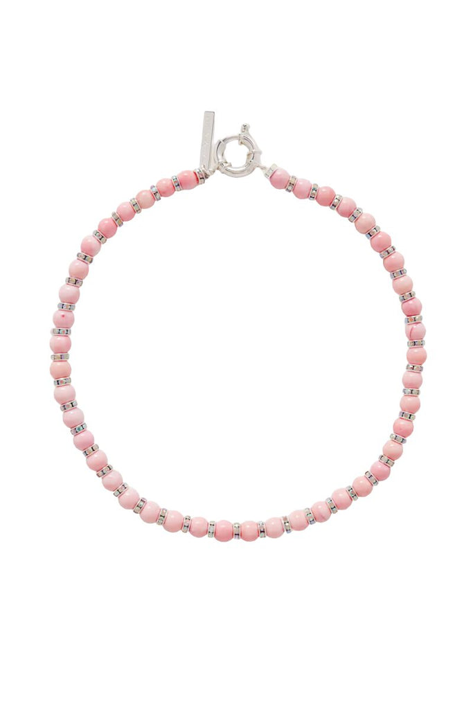 Make a statement with the elegant Pearl Octopuss.y Pink Lily necklace featuring delicate pink shell beads and iridescent crystals that can be dressed up or down.