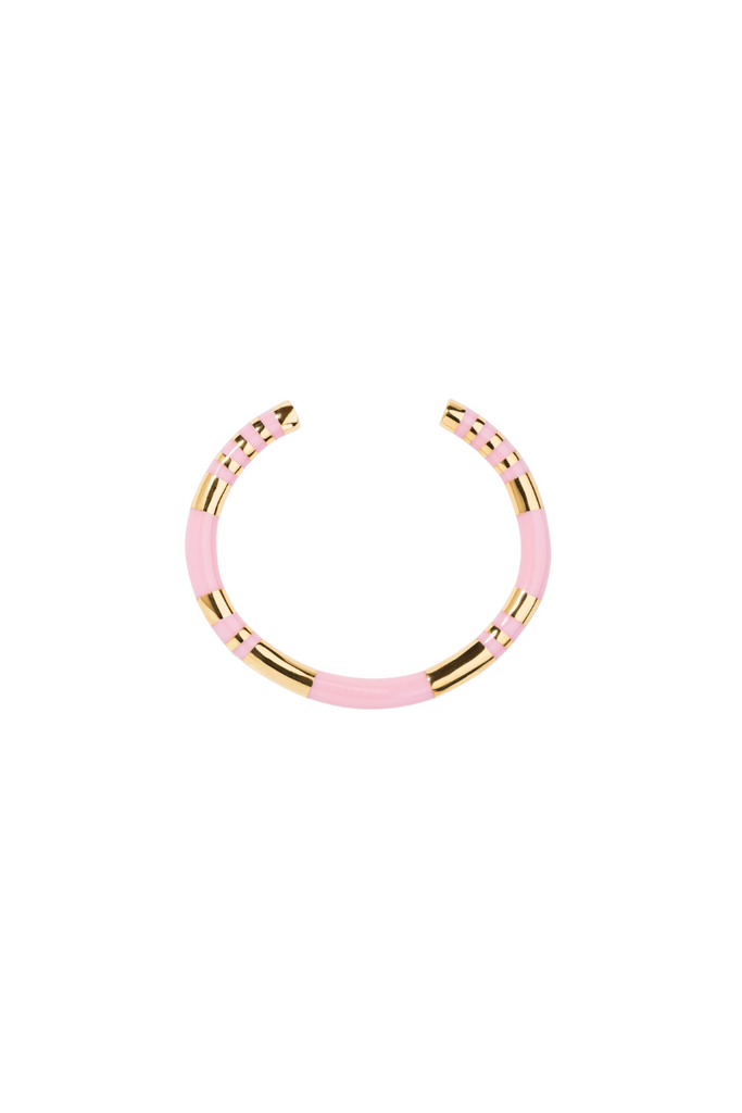 The Positano baby pink bangle by Aurelie Bidermann is nspired by the iconic striped parasols of the Amalfi Coast, this bangle is a beloved best-seller of the house. The delicate baby pink color adds a feminine touch to the sleek and simple design, making it a versatile accessory that can be dressed up or down.