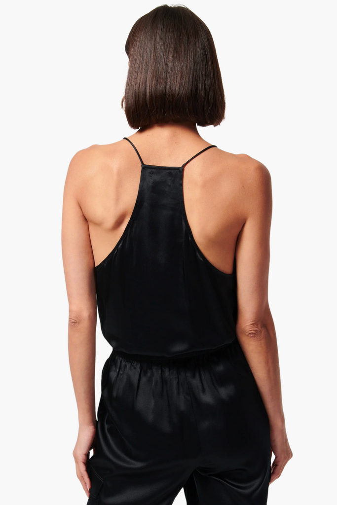 The Racer Charmeuse Cami by Cami NYC is a versatile and luxurious wardrobe essential made from silk sandwash charmeuse, featuring a delicate V-neckline with feminine French lace trimming and a relaxed fitting bodice, perfect for any occasion and available in timeless black.