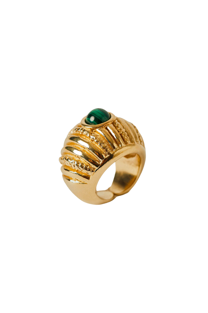 The Reef Ring from Paola Sighinolfi is a handcrafted, 18kt gold-plated organic ring inspired by coral gardens and featuring a green stone that exudes regal elegance and tranquility, making it a timeless and elegant accessory perfect for any formal occasion.