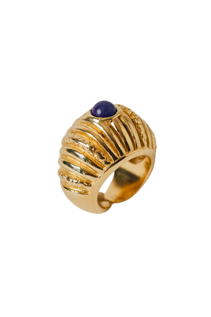 The Small Reef Ring from Paola Sighinolfi is a handcrafted, 18kt gold-plated organic ring inspired by coral gardens and featuring a blue stone that exudes regal elegance and tranquility, making it a timeless and elegant accessory perfect for any formal occasion.