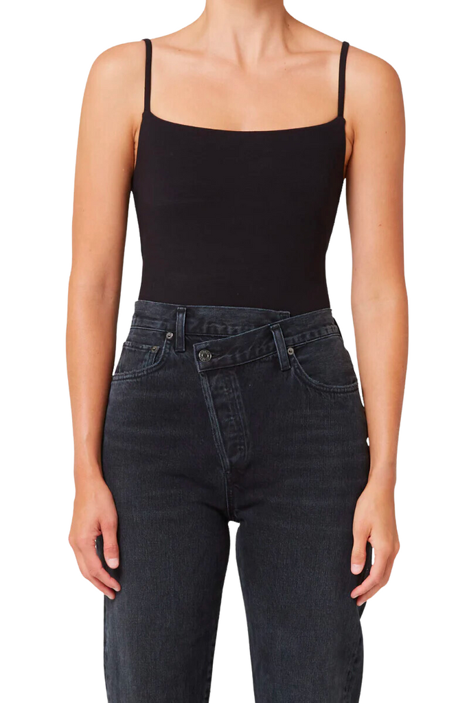 The AGOLDE Squareneck Bodysuit in black is a timeless and versatile piece featuring a flattering square neckline and form-fitting silhouette that pairs perfectly with high-waisted bottoms for a chic and effortless look.