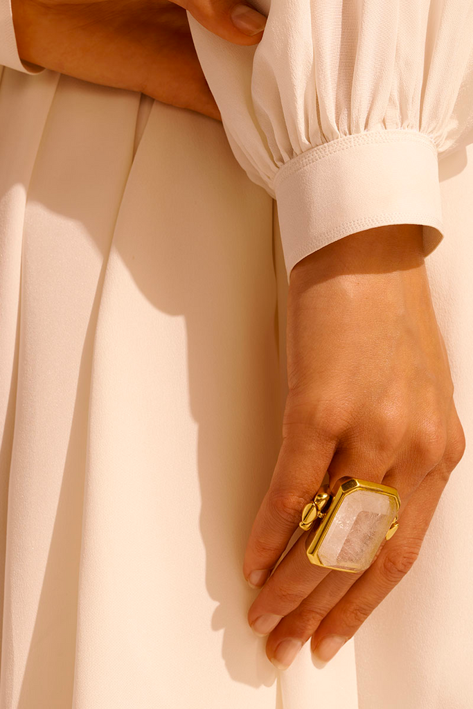 Make a statement with the elegant and sophisticated Stones Large Ring from Goossens Paris, featuring unique emerald-cut semi-precious stones on a 24-carat gold-soaked brass chain that exudes luxury and can be worn with affirmation or discretion for any occasion.
