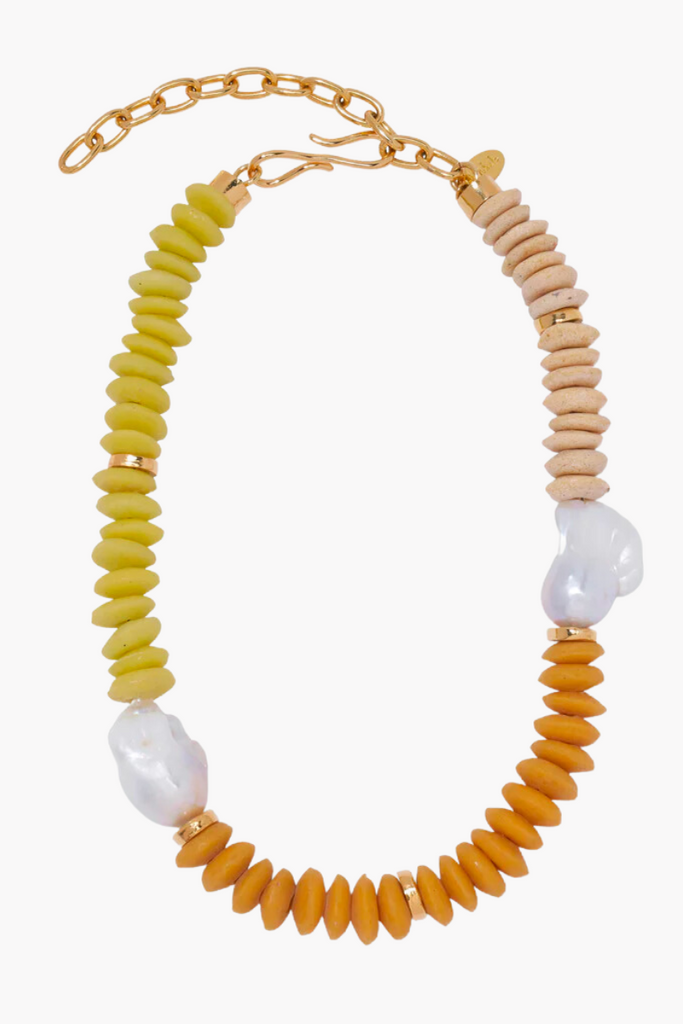 Elevate your summer style with the Tavira Necklace in Sand by Lizzie Fortunato, featuring a stunning color-blocked design of ashanti glass beads, freshwater pearls, and gold-plated accents inspired by the sandy beaches and painted tiles of Portugal.
