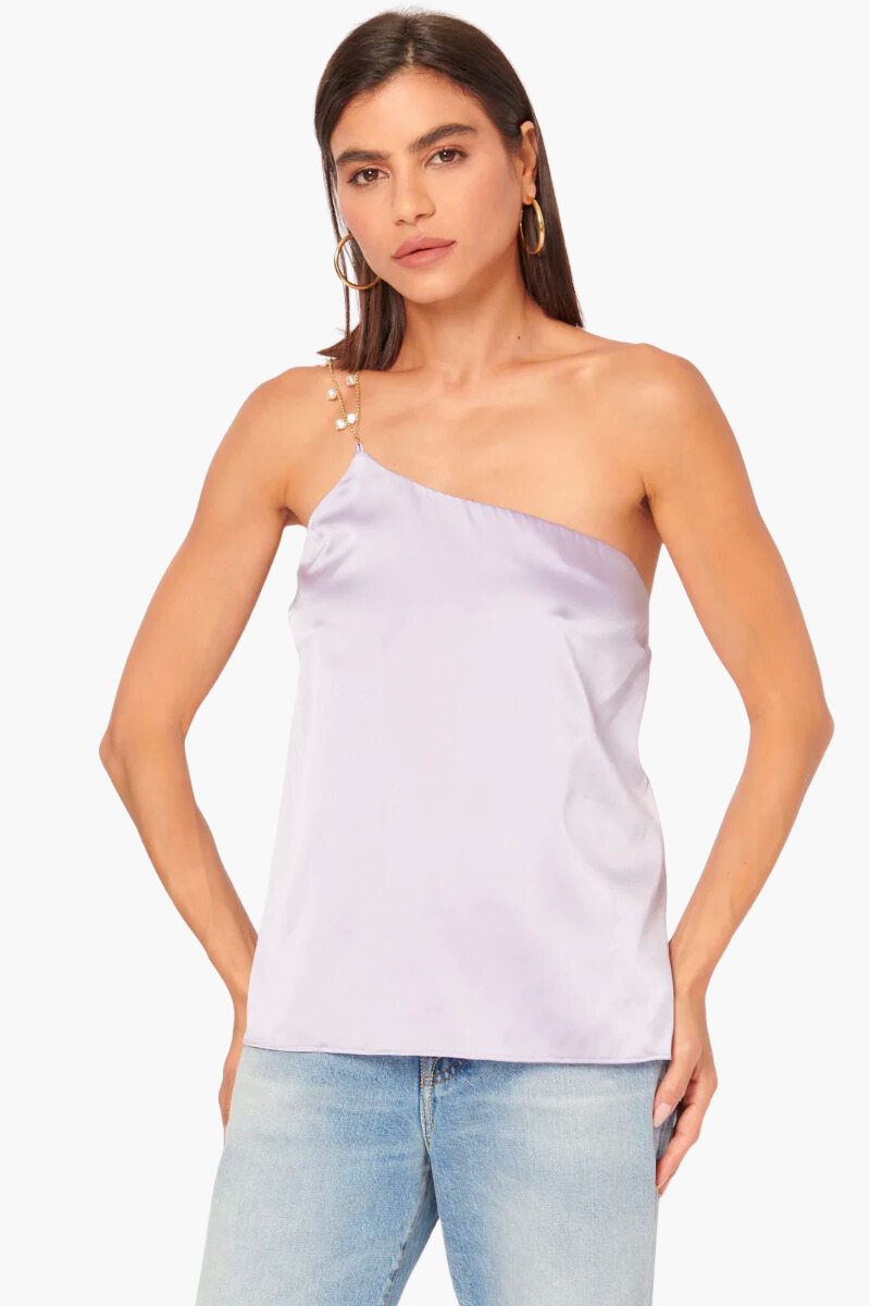 The Tilda Cami is a modern and feminine one-shoulder camisole made of luxurious silk stretch sandwash charmeuse, featuring double straps adorned with baroque pearls.