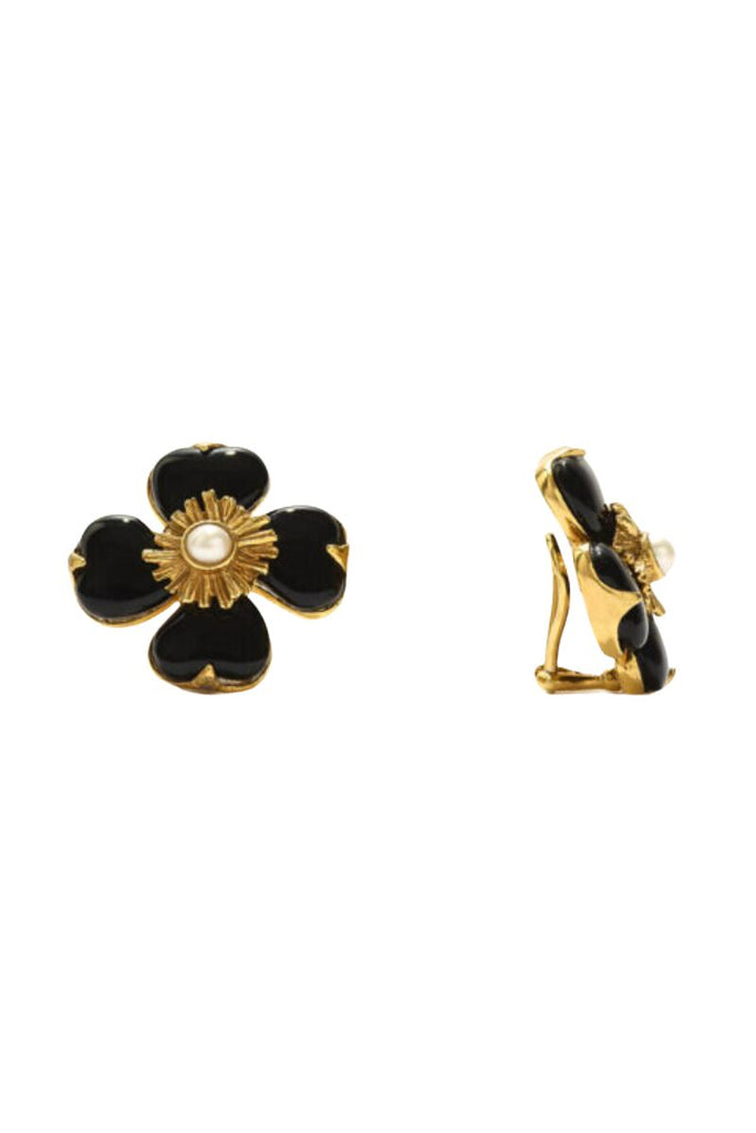 The Trefle Clip Earrings by the House of Goossens are an exquisite and feminine piece featuring three clovers with rock crystal stones and freshwater pearls, available in pink quartz and black agate.