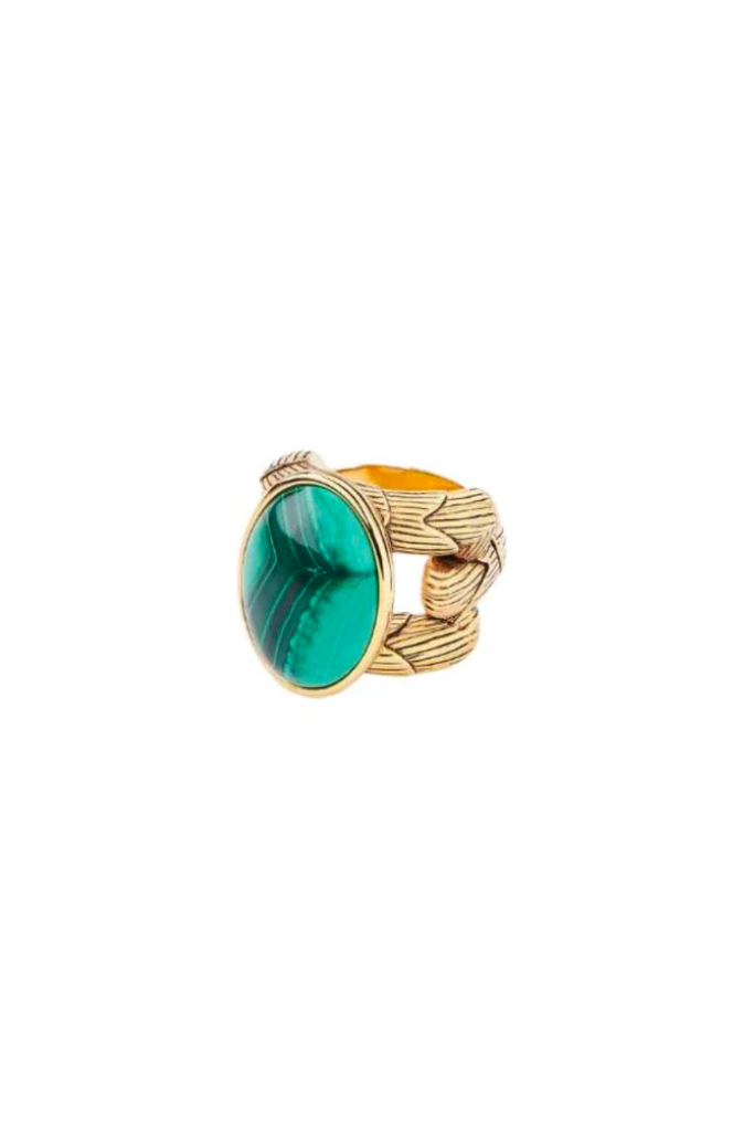 Adorn your finger with the exquisite Tucuma Ring by Aurelie Bidermann, featuring a green malachite cabochon and gleaming gilt metal band.