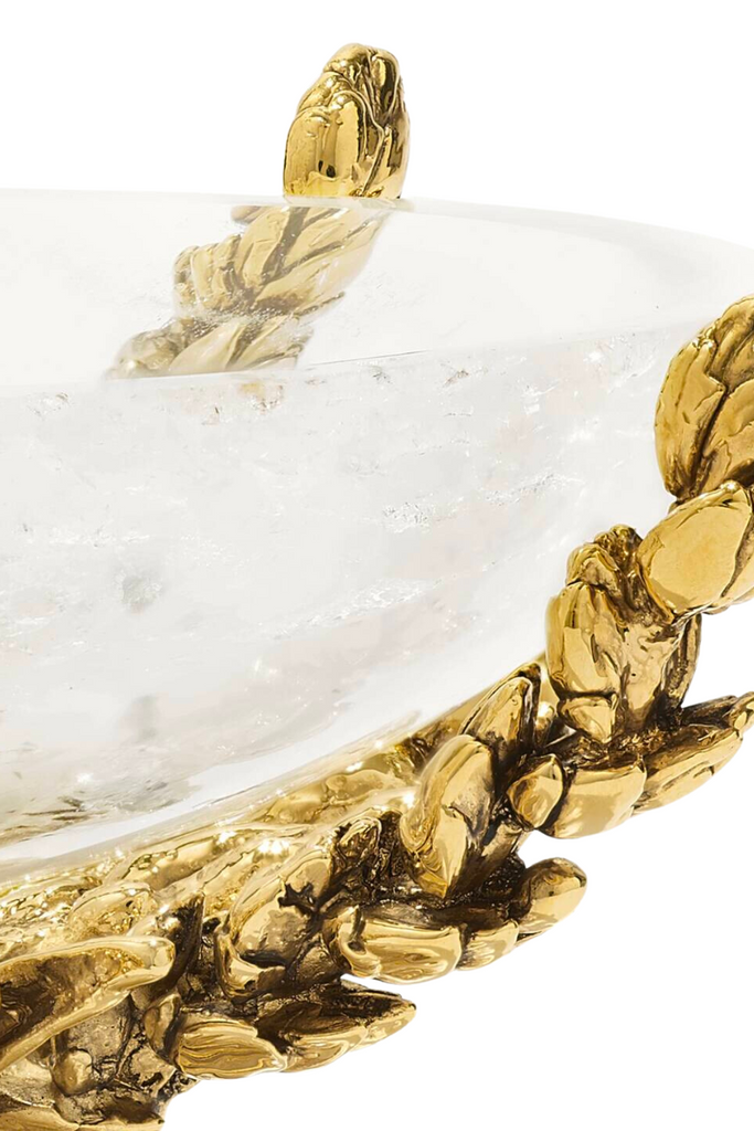 The Wheat Cup by Goossens Paris is a stunning rock crystal cup adorned with delicate ears of wheat in metal and intricate motifs of shell, coral, foliage, and water lily, featuring a pedestal bathed in 24-carat gold for a radiant yellow gold finish.
